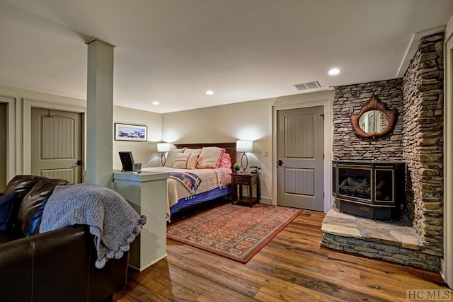 bedroom with hardwood / wood-style floors