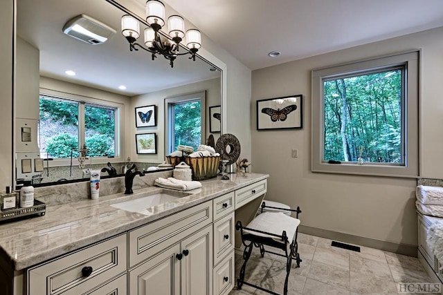 bathroom with vanity and a wealth of natural light