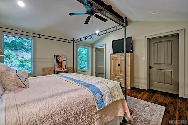 bedroom featuring dark hardwood / wood-style flooring, lofted ceiling, and ceiling fan