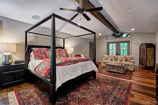 bedroom featuring dark wood-type flooring, ceiling fan, wood walls, and vaulted ceiling with beams