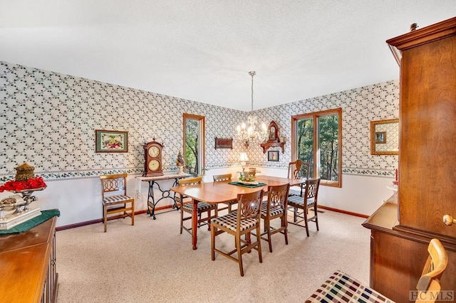 dining area with a chandelier and light carpet