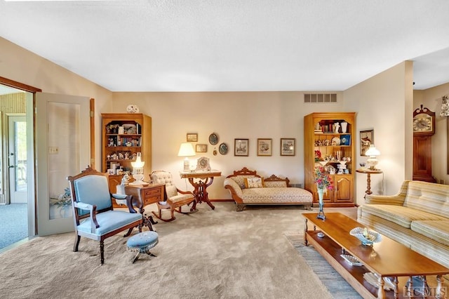 living room featuring light carpet