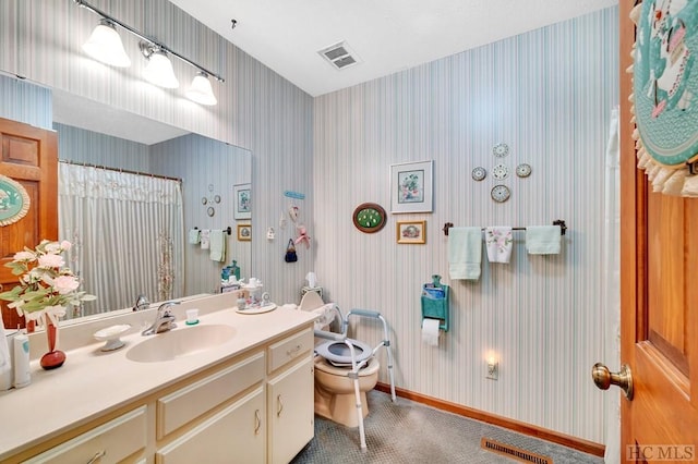 bathroom with vanity, a shower with curtain, and toilet