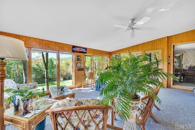 sunroom / solarium featuring vaulted ceiling and ceiling fan