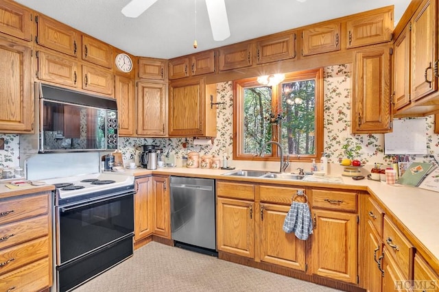 kitchen featuring dishwasher, sink, backsplash, electric range, and ceiling fan