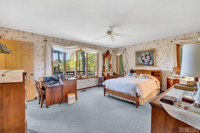 bedroom with ceiling fan and light colored carpet