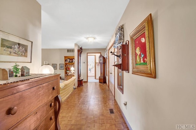 corridor featuring light parquet floors