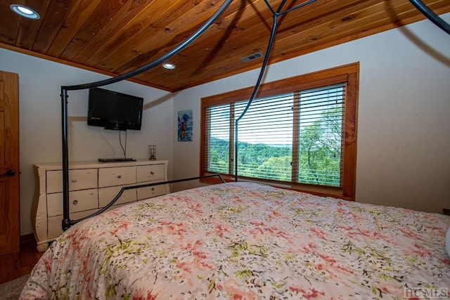 bedroom featuring wood ceiling and vaulted ceiling