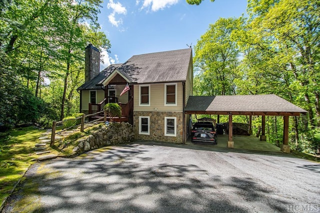 view of front of home featuring a carport