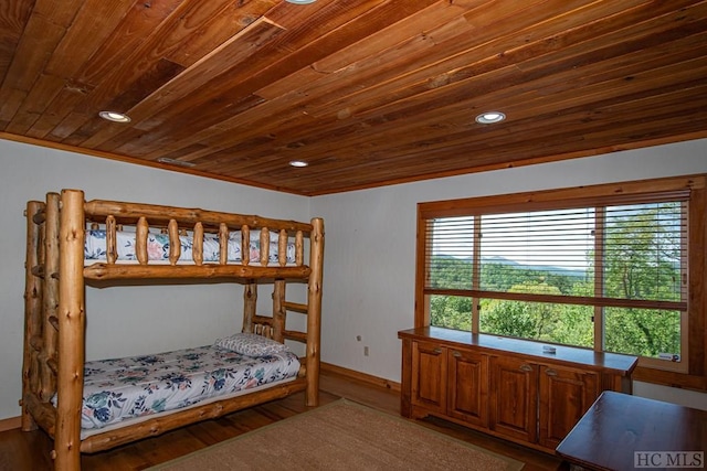 bedroom featuring hardwood / wood-style flooring and wooden ceiling