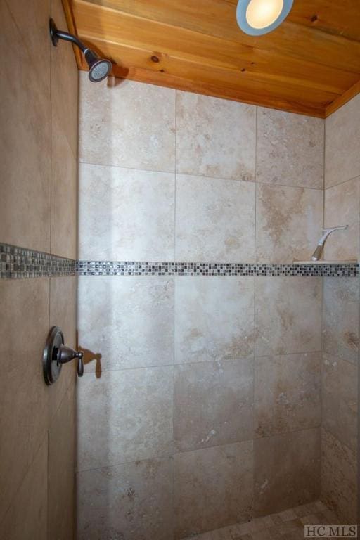 interior space featuring tiled shower