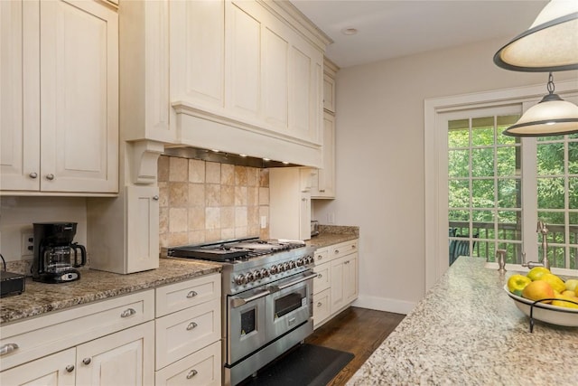 115 Falls Ct W, Highlands, NC 28741 - kitchen with double oven range, dark wood-style flooring, tasteful backsplash, decorative light fixtures, and light stone counters