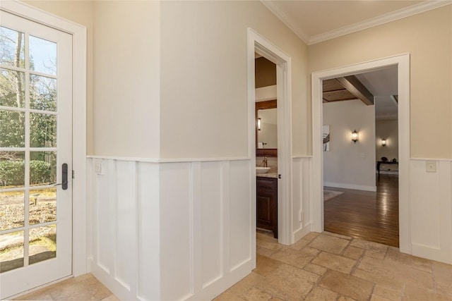 115 Falls Ct W, Highlands, NC 28741 - hall featuring wainscoting, stone tile flooring, ornamental molding, a decorative wall, and beamed ceiling