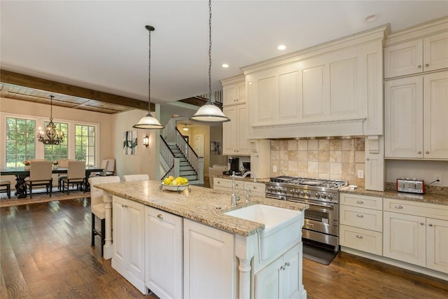 115 Falls Ct W, Highlands, NC 28741 - kitchen featuring high end stainless steel range oven, cream cabinets, hanging light fixtures, decorative backsplash, and recessed lighting