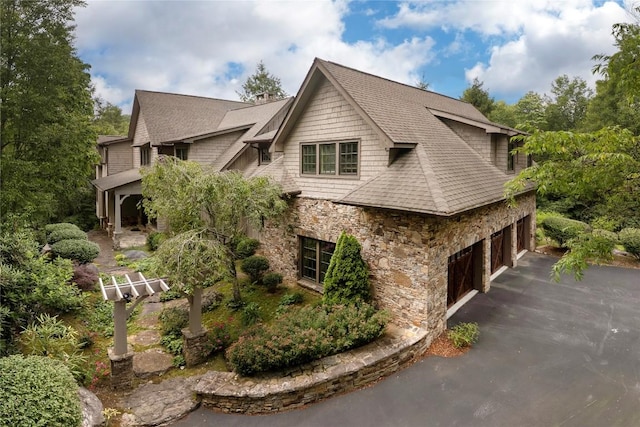 115 Falls Ct W, Highlands, NC 28741 - view of side of property with stone siding, driveway, and a garage