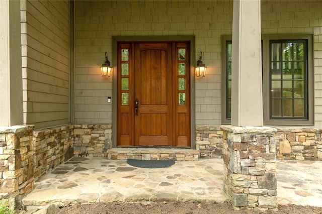115 Falls Ct W, Highlands, NC 28741 - doorway to property with stone siding and covered porch