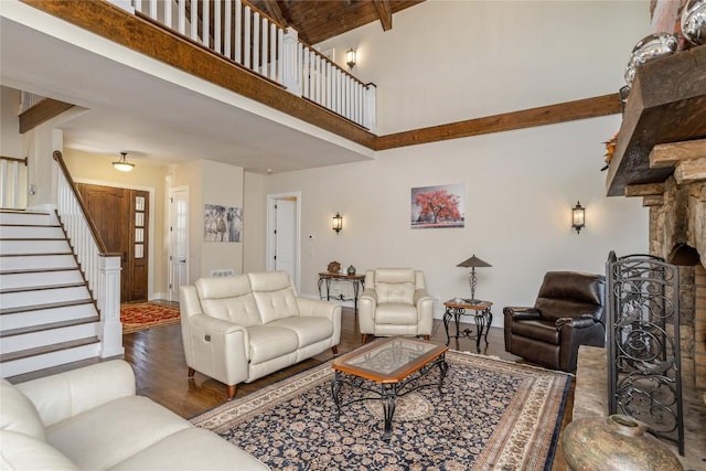 115 Falls Ct W, Highlands, NC 28741 - living area with high vaulted ceiling, stairs, wood finished floors, and beam ceiling