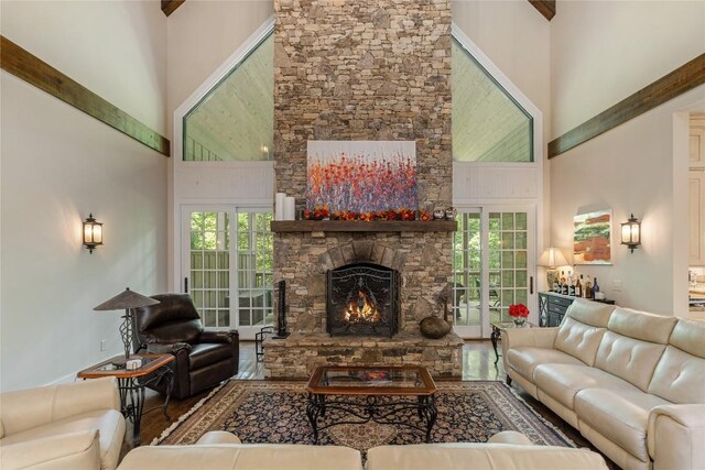 115 Falls Ct W, Highlands, NC 28741 - living area with a towering ceiling, a stone fireplace, and wood finished floors