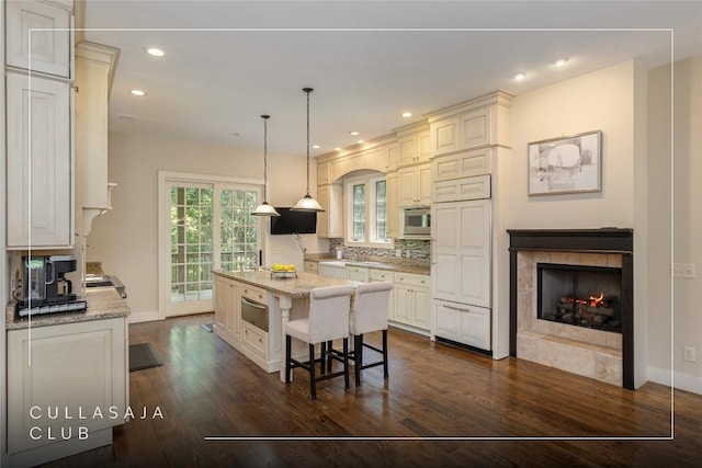 115 Falls Ct W, Highlands, NC 28741 - kitchen featuring built in appliances, a fireplace, dark wood finished floors, a center island, and recessed lighting