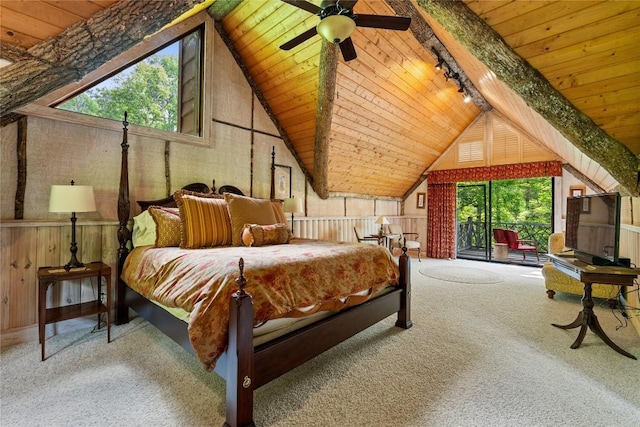 carpeted bedroom with high vaulted ceiling, wooden walls, track lighting, and wood ceiling