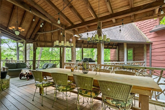 wooden terrace with an outdoor living space