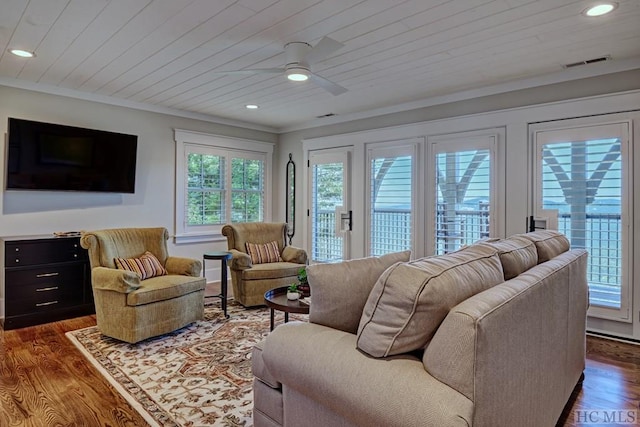 living room featuring ceiling fan, wooden ceiling, dark hardwood / wood-style floors, and ornamental molding