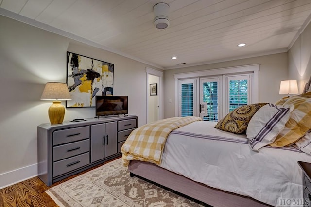 bedroom with access to exterior, hardwood / wood-style floors, and ornamental molding