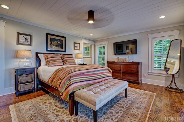 bedroom featuring ceiling fan, dark hardwood / wood-style flooring, and wooden ceiling