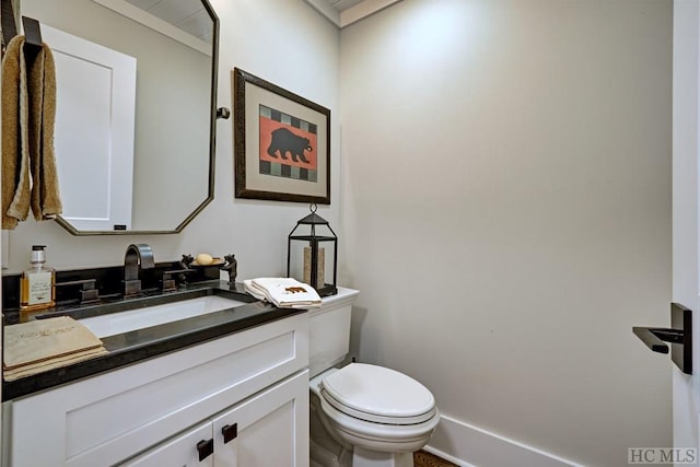 bathroom with toilet and vanity