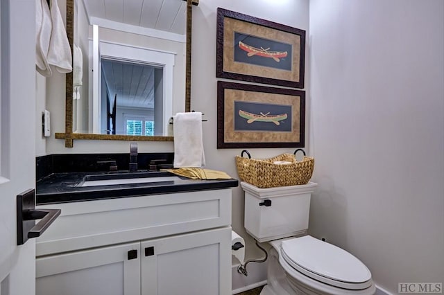 bathroom with toilet and vanity