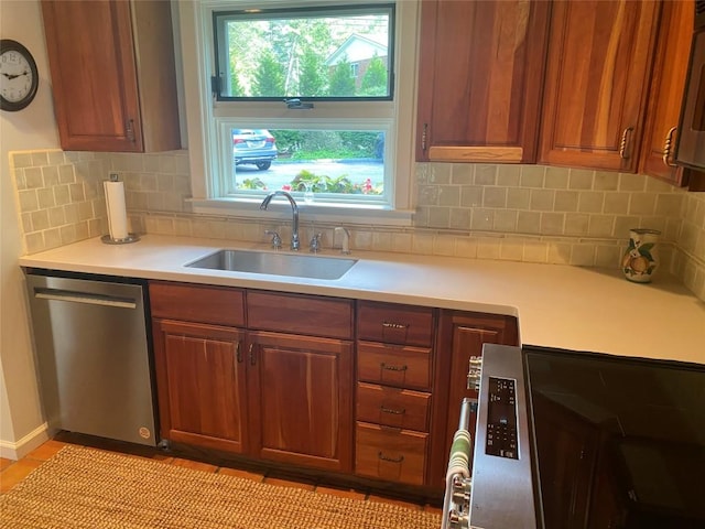 711 Horse Cove Rd Unit C-4, Highlands, NC 28741 - kitchen featuring stainless steel dishwasher, light countertops, tasteful backsplash, and brown cabinets
