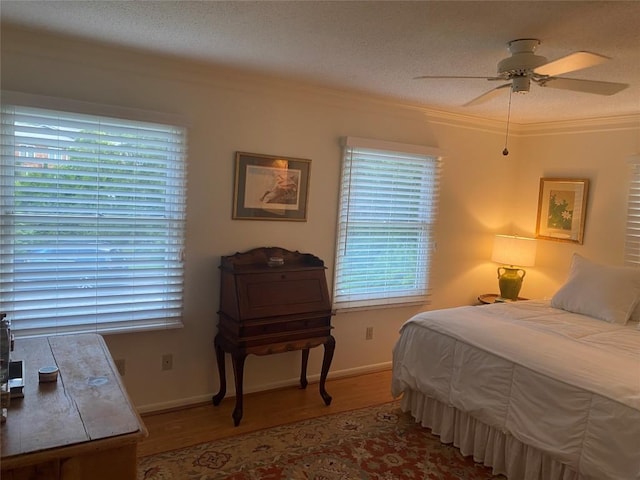 711 Horse Cove Rd Unit C-4, Highlands, NC 28741 - bedroom featuring wood finished floors, ornamental molding, and ceiling fan