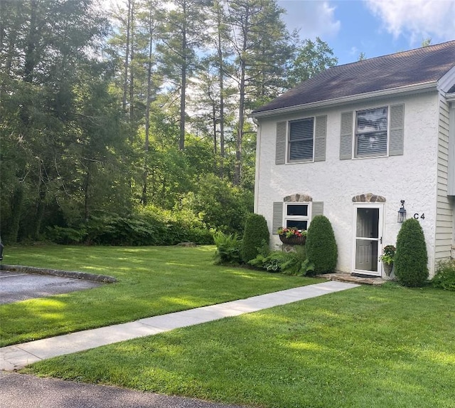 711 Horse Cove Rd Unit C-4, Highlands, NC 28741 - view of front facade featuring a front lawn and stucco siding