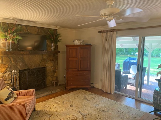 711 Horse Cove Rd Unit C-4, Highlands, NC 28741 - living area with wood finished floors, crown molding, a baseboard radiator, ceiling fan, and a stone fireplace