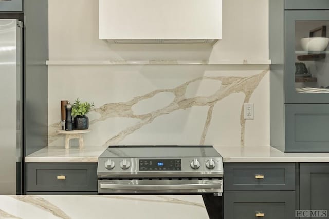 kitchen with appliances with stainless steel finishes and gray cabinets