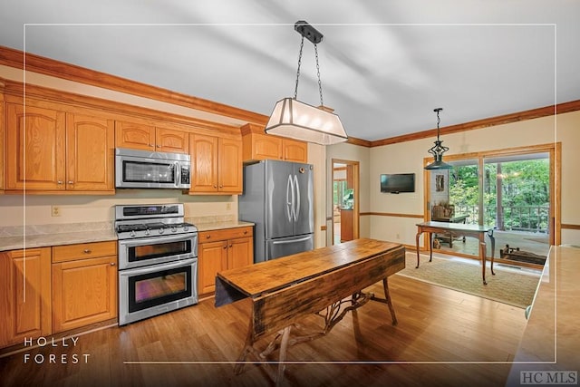 kitchen featuring crown molding, light stone counters, decorative light fixtures, dark hardwood / wood-style flooring, and stainless steel appliances