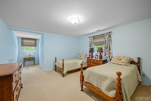 bedroom featuring light colored carpet