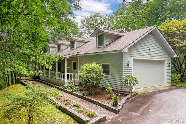 exterior space with a porch and a garage