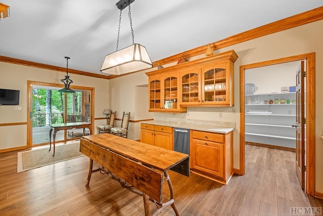 kitchen with pendant lighting, ornamental molding, and light hardwood / wood-style floors