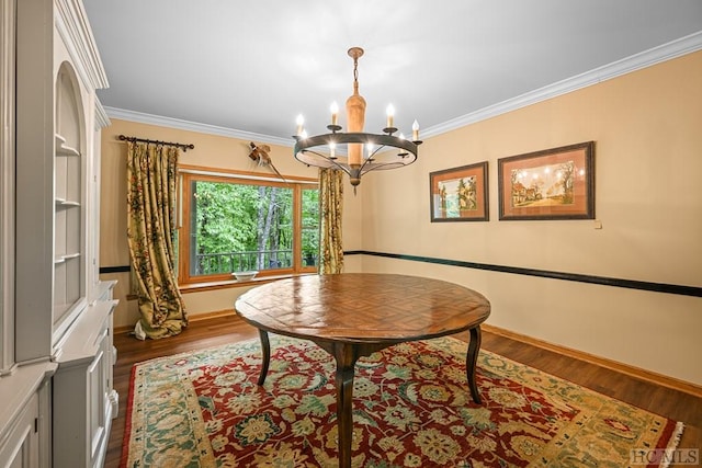 dining space featuring crown molding, dark hardwood / wood-style floors, and a notable chandelier