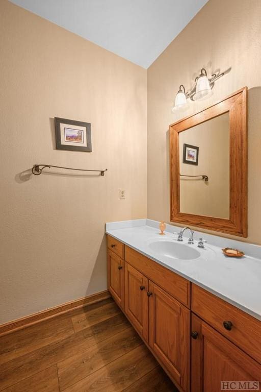 bathroom featuring vanity and hardwood / wood-style floors