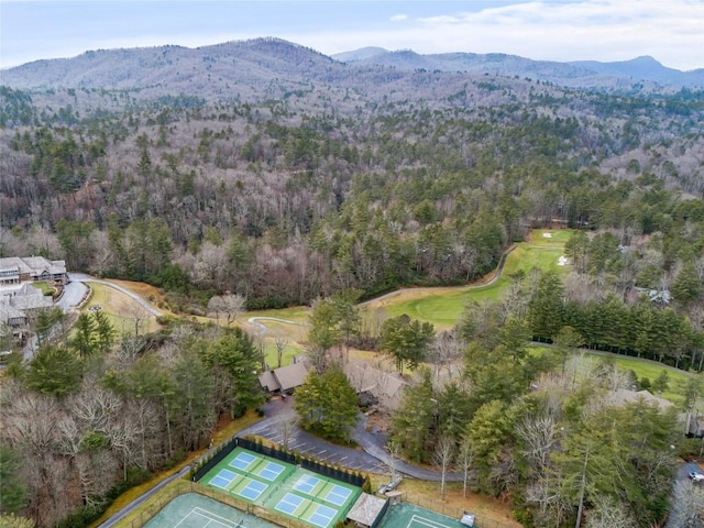 bird's eye view with a mountain view and a wooded view