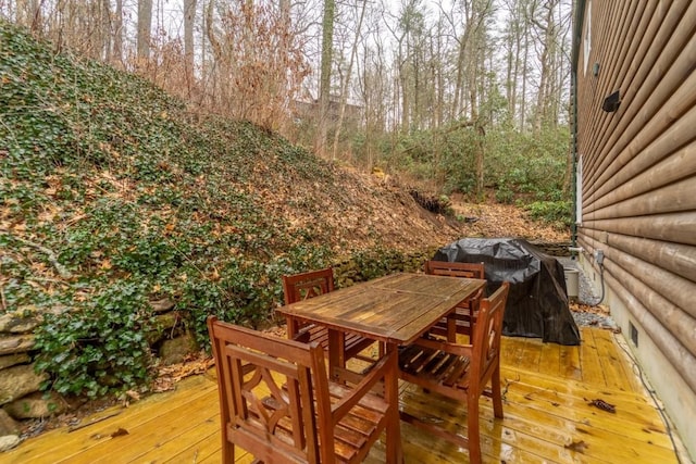 deck with area for grilling and outdoor dining area