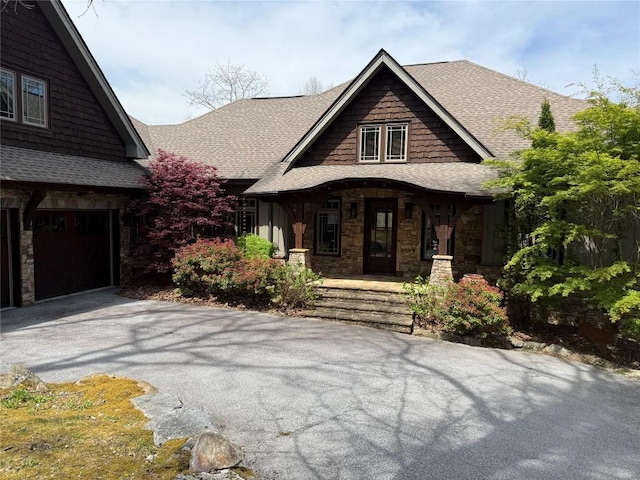 159 Highlands Pt, Highlands, NC 28741 - craftsman inspired home with a shingled roof, stone siding, covered porch, and asphalt driveway