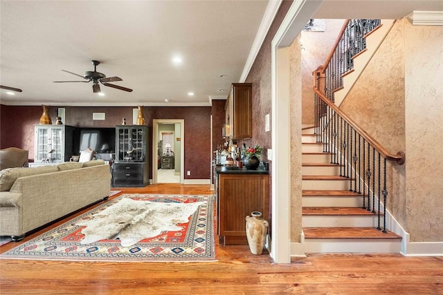159 Highlands Pt, Highlands, NC 28741 - living room with wood finished floors, crown molding, stairs, a ceiling fan, and recessed lighting