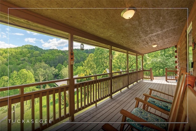 deck with a wooded view