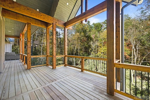 wooden terrace featuring grilling area