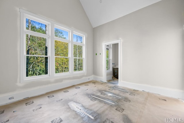 empty room featuring high vaulted ceiling