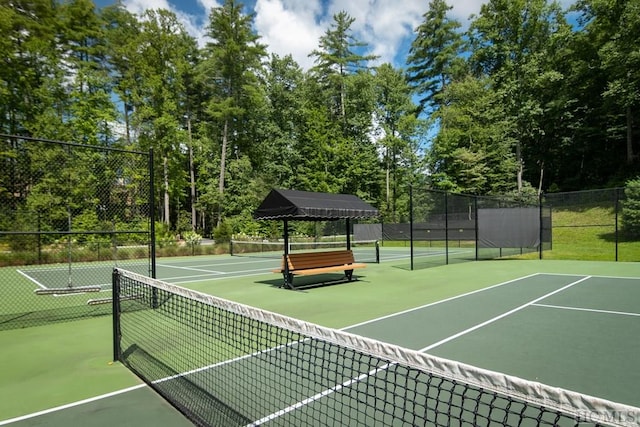 view of sport court with fence