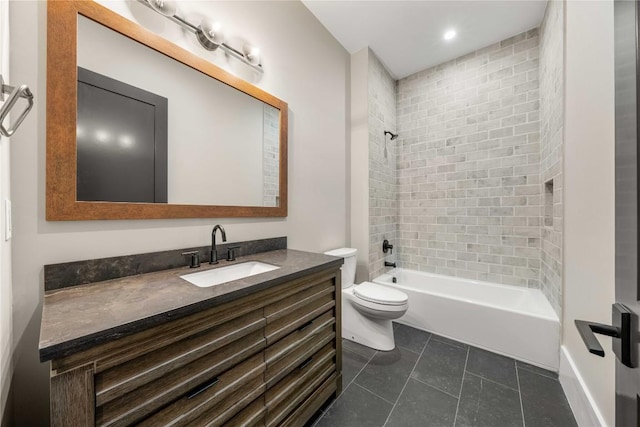 full bathroom with washtub / shower combination, vanity, toilet, and tile patterned floors